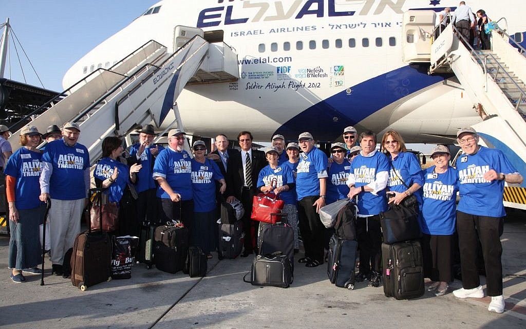 A group of retirees gathers after arriving in Israel in August, part of an aliya trip organized by Nefesh B'Nefesh. (Photo credit: Nefesh B'Nefesh via JTA)