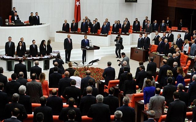 Turkish lawmakers and ministers  at Turkey's parliament in Ankara (photo credit: AP)