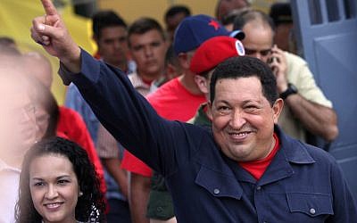 Venezuela's President Hugo Chavez leaves a polling station in Caracas after voting in presidential elections, October 8, 2012 (photo credit: AP/Rodrigo Abd)