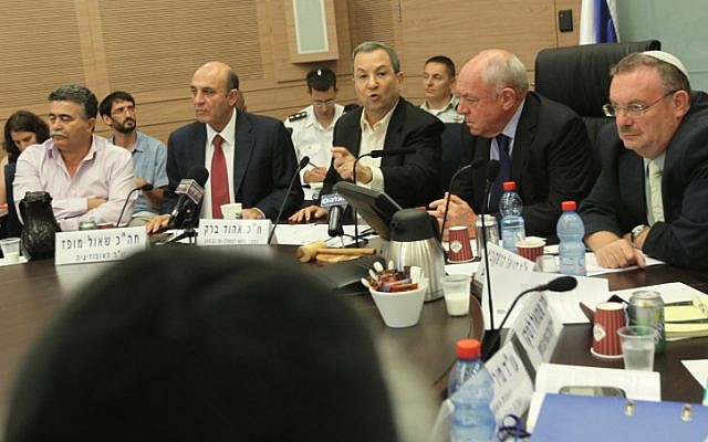 Defense Minister Ehud Barak sparring with the members of the Knesset Foreign Affairs and Defense Committee on Monday (photo credit: Miriam Alster/ Flash90)