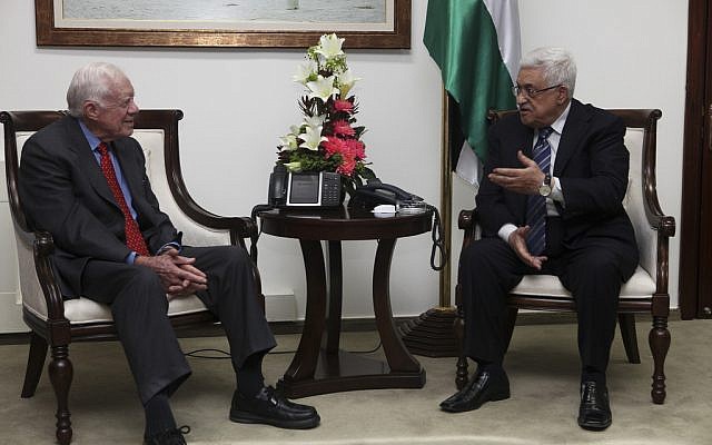 Jimmy Carter, left, with PA President Mahmoud Abbas in Ramallah (photo credit: Mati Milstein/The Elders)