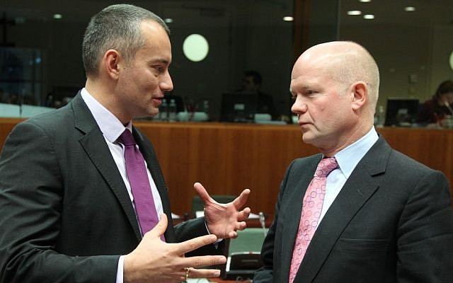 Bulgarian Foreign Minister Nikolay Mladenov (left) with UK Foreign Minister William Hague in Brussels (photo credit: Yves Logghe/AP)
