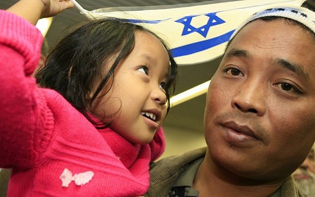Bnei Menashe immigrants arrive at Ben Gurion Airport from India in 2006. (Nati Shohat/Flash90)