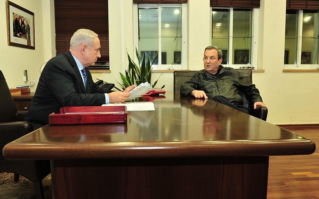 Prime Minister Benjamin Netanyahu speaks with Defense Minister Ehud Barak at the Defense Ministry in Tel Aviv on November 14, 2012. (photo credit: Ariel Hermoni/Ministry of Defense/Flash90)
