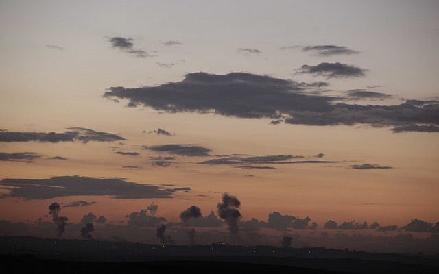 Smoke billows over Gaza after a series of IAF airstrikes that marked the onset of Operation Pillar of Defense, Wednesday, November 14, 2012 (photo credit: Edi Israel/Flash90)