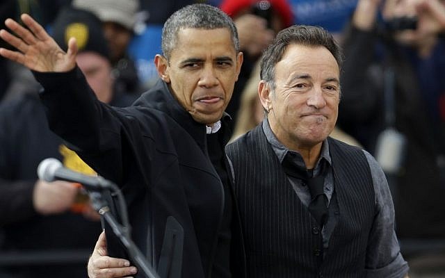 File. President Barack Obama, accompanied by singer Bruce Springsteen, waves as he arrives at a campaign event near the State Capitol Building in Madison, Wis., Monday, Nov. 5, 2012. (AP Photo/Pablo Martinez Monsivais)