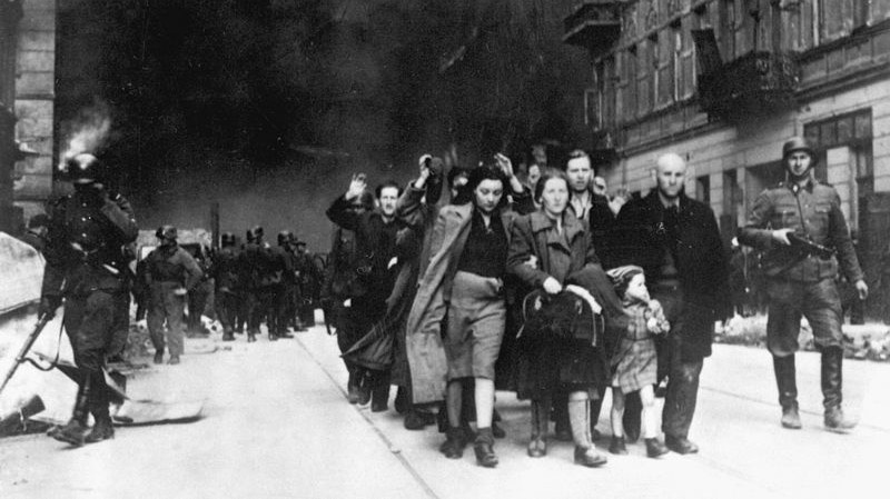 Jews in the Warsaw Ghetto are led by German soldiers to an assembly point for deportation to death camps, 1943. (photo credit: public domain)