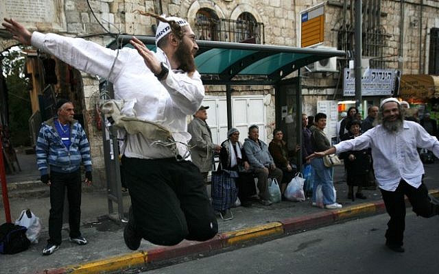 Ultra Orthodox Jewish followers of the Hassidic Breslov sect dance in a Jerusalem street, November 2009 (photo credit: Miriam Alster/Flash90)