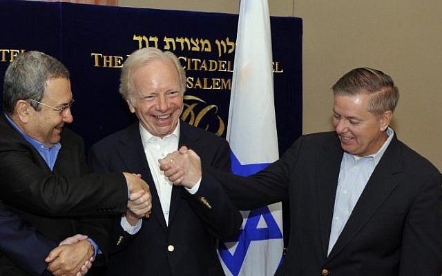 US Senators Joe Lieberman and Lindsay Graham meet with Defense Minister Ehud Barak in Jerusalem, in 2010 (photo credit: Ariel Hermoni/Ministry of Defence/Flash90)