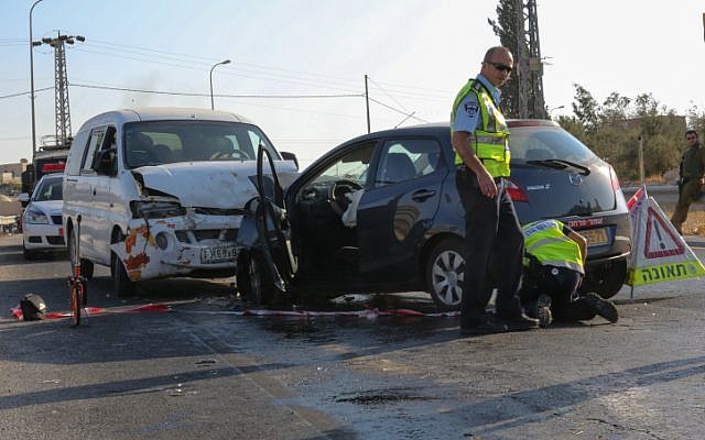 Policemen at the scene of a car accident, September 2012 (photo credit: Oren Nahshon/Flash90)