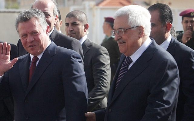 Palestinian Authority President Mahmoud Abbas, right, welcomes King Abdullah II, left, in Ramallah on December 6, 2012. (photo credit: Issam Rimawi/Flash90)