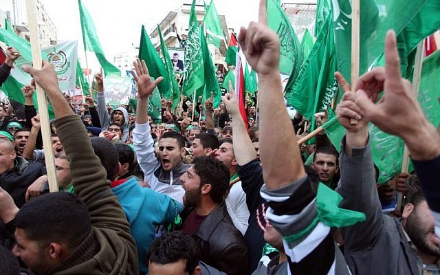 Palestinian supporters of Hamas at a rally marking the terrorist organization's 25th anniversary in the West Bank city of Ramallah (photo credit: Issam Rimawi/Flash90)