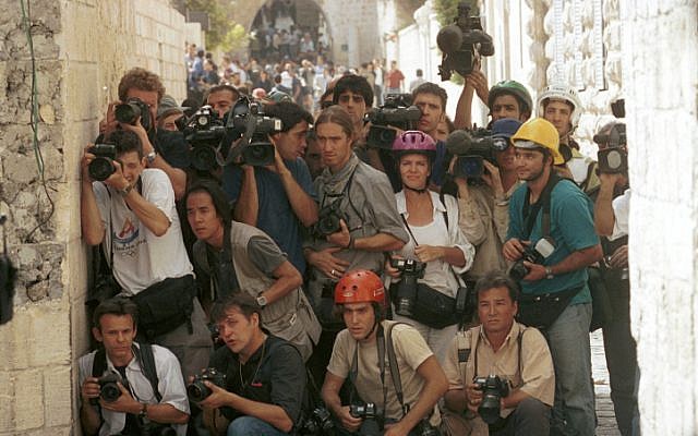 Foreign journalists cover clashes between Israelis and Palestinians in 2000. (photo credit: Nati Shohat/Flash90)