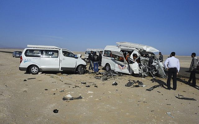The aftermath of a two-vehicle accident, which left at least five Germans and three Egyptians dead and others injured on the road between Hurghada and Safaga on the Red Sea coast of Egypt on Sunday. (AP)