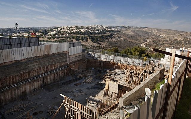 Illustrative photo of a construction site in the East Jerusalem neighborhood of Ramat Shlomo, December 2012 (AP/Dan Balilty)