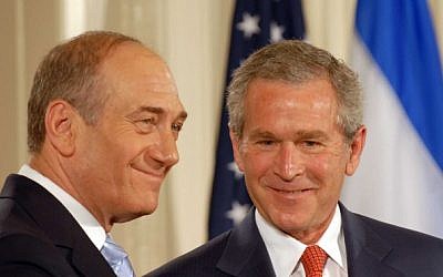 Then-US president George W. Bush welcomes then-prime minister Ehud Olmert to the Oval Office of the White House in Washington in May of 2006. (photo credit: Avi Ohayon/GPO/Flash90)