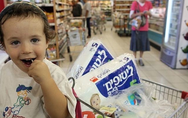 Illustrative: A young boy in the supermarket checkout line (photo credit: Nati Shohat/Flash90)