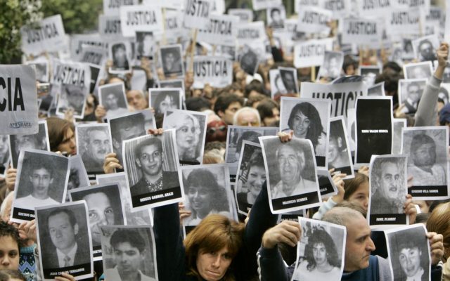 Families of victims of the 1994 AMIA bombing mark the anniversary of the attack in 2006. (photo credit: AP/Natacha Pisarenko)