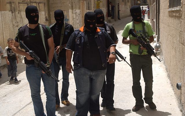 Masked members of Fatah's military branch patrol the streets in 2007. (photo credit: Wagdi Ashtiyeh/Flash90)