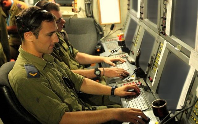 IDF soldiers at a control board in the National Cyber Bureau (Photo credit: Moshe Shai/FLASH90)