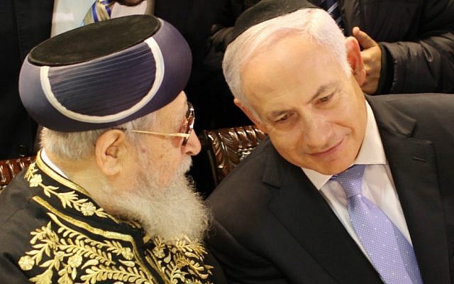 Prime Minister Benjamin Netanyahu listens to Shas spiritual leader Rabbi Ovadia Yosef at the bar mitzvah of party chairman Eli Yishai's son, in February 2011. (photo credit: Ilia Yefimovich/Flash90)