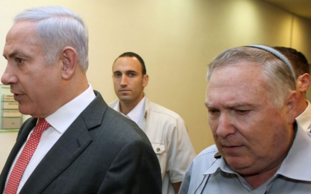 Prime Minister Benjamin Netanyahu (left) with his then-aide Natan Eshel, on August 28, 2011. (Amit Shabi/pool/Flash90/File)