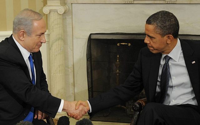Benjamin Netanyahu, left, and Barack Obama shaking hands at a meeting in the White House in March 2012 (photo credit:  Amos Ben Gershom/GPO/Flash90)
