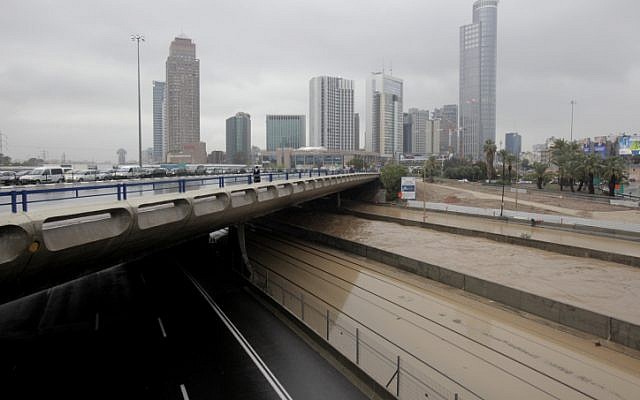 The Ayalon River flows alongside the flooded Ayalon Highway in Tel Aviv on Tuesday, Jan. 8 (photo credit: Flash90)