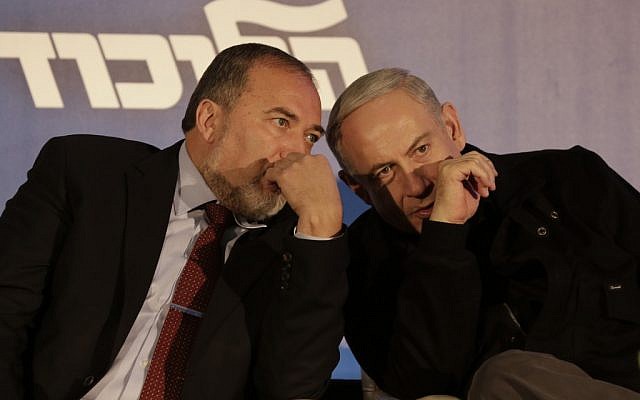 Avigdor Liberman (left), and Benjamin Netanyahu sharing a private word in January 2013. (Tsafrir Abayov/Flash90)