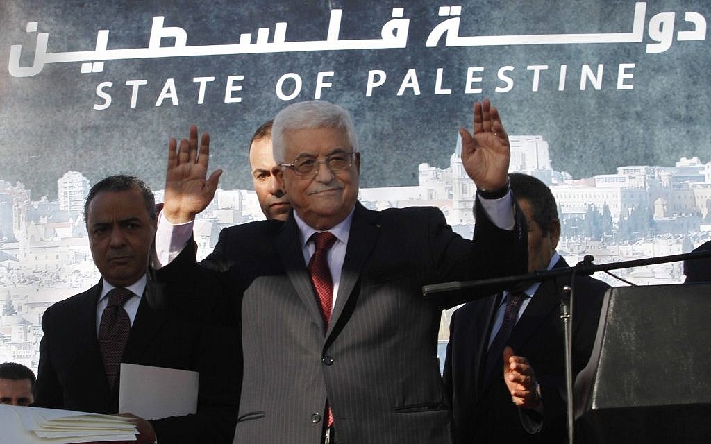 Palestinian President Mahmoud Abbas waves to the crowd during celebrations for their successful bid to win UN statehood recognition on Dec. 2, 2012. (photo credit: Nasser Shiyoukhi/AP)