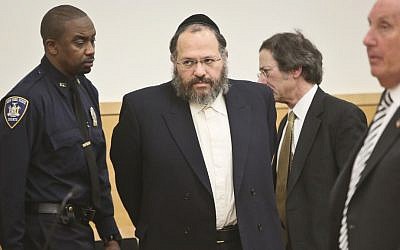 Nechemya Weberman, second left, is lead to court Tuesday, January 22, 2013, in New York. (photo credit: AP Photo/Bebeto Matthews)