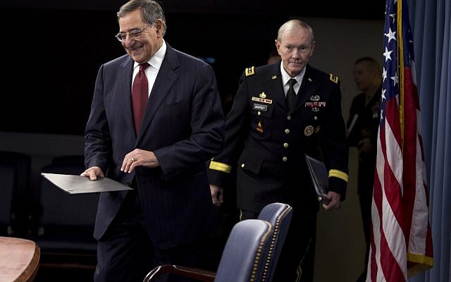 US Defense Secretary Leon Panetta and Joint Chiefs Chairman Gen. Martin Dempsey arrive for their news conference at the Pentagon on Thursday, January 10, 2013. (photo credit: Evan Vucci/AP)
