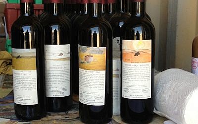 Handpainted labels by Erez Rota on his wines (photo credit: Jessica Steinberg/Times of Israel)