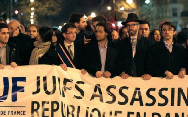 Members of the Union of French Jewish Students demonstrate in Paris with a sign that reads, 'Jews murdered, republic endangered.' (Courtesy of UEJF via JTA)