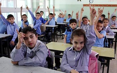 Palestinian children attend the first day of school in the West bank city of Ramallah. September 4, 2011 (Issam Rimawi/Flash90)