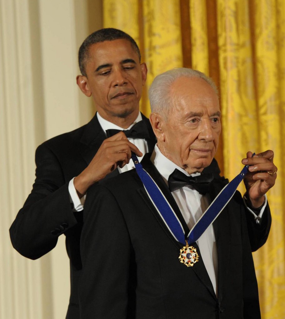US President Barack Obama presents the Presidential Medal of Freedom to President Shimon Peres in the White House, June 13, 2012 (photo credit: Amos Ben Gershom/GPO/Flash90)