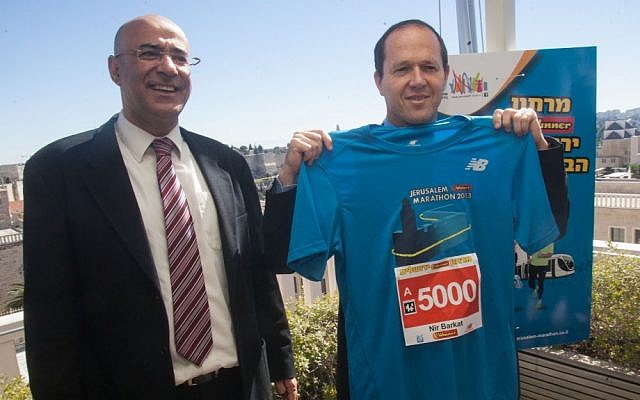 Mayor Nir Birkat, gearing up with his new, Jerusalem Marathon 2013 shirt (Courtesy Flash 90)
