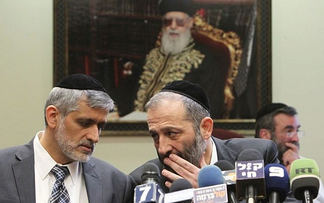 Shas leaders Eli Yishai (left) and Aryeh Deri during a Shas party meeting in the Knesset on February 18, 2013. (Photo credit: Miriam Alster/FLASH90)