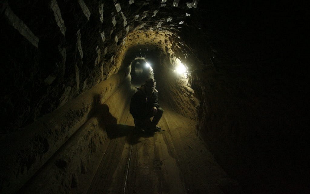 A Palestinian worker inside a smuggling tunnel, beneath the Egyptian-Gaza border in the southern Gaza Strip, in February 2013 (photo credit: Abed Rahim Khatib/Flash90)