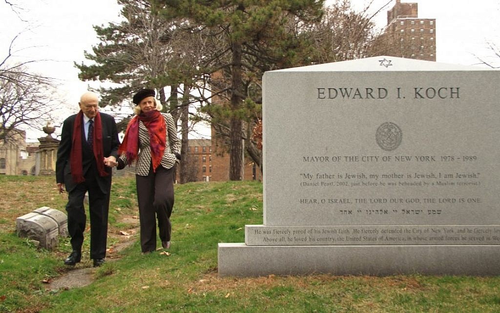 The former New York mayor visits his own gravestone in the documentary 'Koch.' (Courtesy Zeitgeist Films)