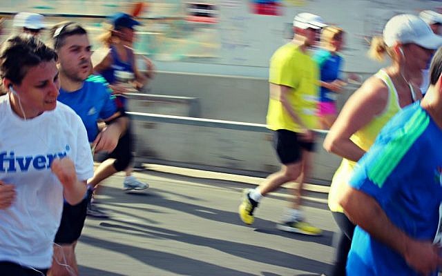 Runners take part in the Tel Aviv half marathon on Friday (photo credit: courtesy of Jonathan Fisch)