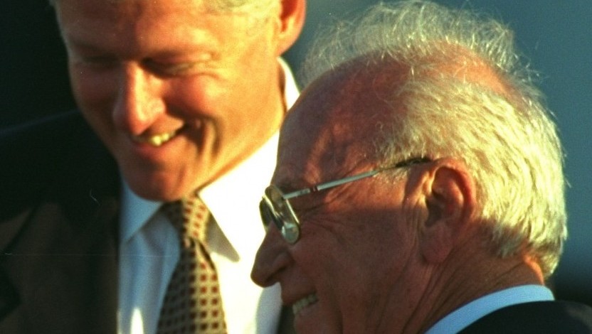 Then-US president Bill Clinton laughs with prime minister Yitzhak Rabin upon his arrival at Ben Gurion Airport, October 27, 1994. Clinton arrived in Israel after a trip to Syria where he met with president Hafez Assad in an attempt to further the Middle East peace process. Later, speaking to the Knesset, Clinton said of Syria, 'Its leaders understand it is time to make peace.' (AP/David Brauchli)
