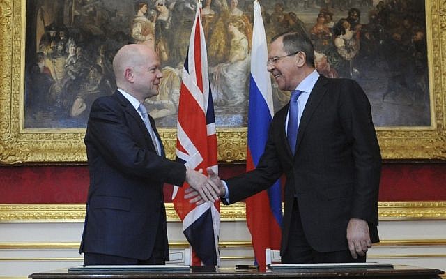 Britain's Foreign Secretary William Hague, left, shakes hands with after signing an agreement to hold further talks with Foreign Minister of Russia Sergei Lavrov during a joint Britain - Russia, foreign and defence ministerial conference at Lancaster House in London Wednesday March 13, 2013 (Photo credit: Stefan Rousseau/AP)