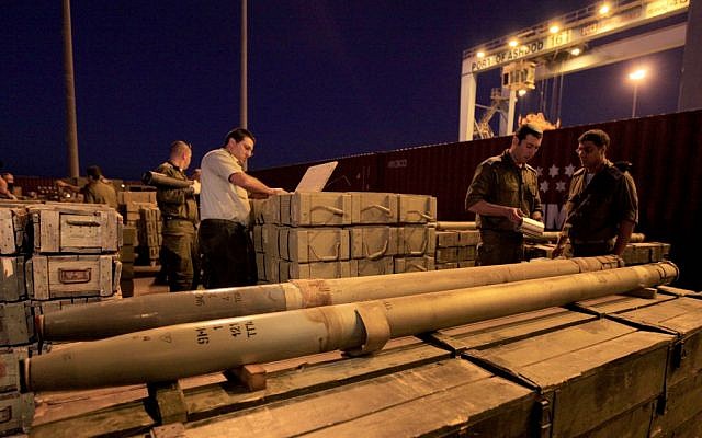 Israeli soldiers unpack rockets seized by Israeli authorities on a ship near Cyprus, and presented in the port of the Israeli city of Ashdod, Wednesday, Nov. 4, 2009 (photo credit: Tsafrir Abayov/Flash90)