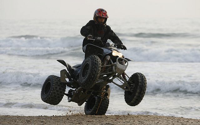 Illustrative image of a man riding an All Terrain Vehicle. (photo credit: Moshe Shai/Flash90)