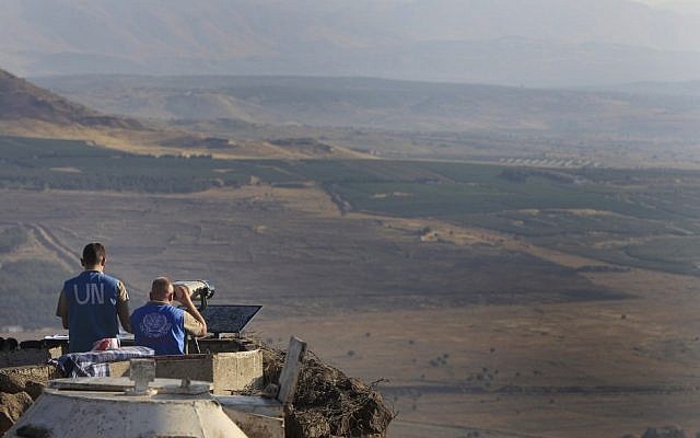 UN peacekeepers monitor the Syrian side of the border from an Israeli army post at Mount Bental near Kibbutz Merom Golan in the Golan Heights in July 2012. (photo credit: Tsafrir Abayov/Flash90)