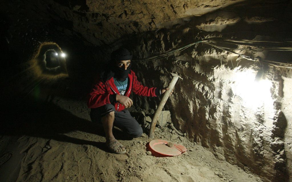 A Palestinian inside a smuggling tunnel, beneath the Egyptian-Gaza border, February 2013. (photo credit: Abed Rahim Khatib/Flash90)