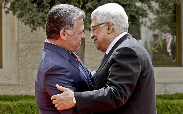 King Abdullah II of Jordan, left, welcomes Palestinian Authority President Mahmoud Abbas after his arrival at the Royal Palace in Amman, Jordan, in March, 2013. (AP Photo/ Raad Adayleh)