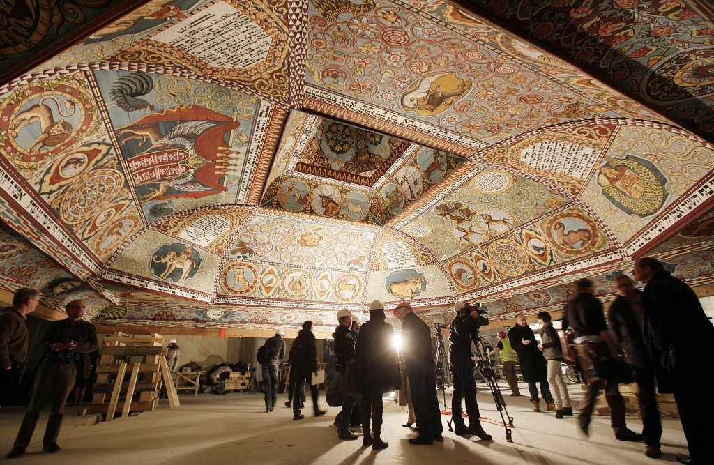 Visitors inspect the painted ceiling of a reconstructed wooden synagogue at Warsaw's Museum of the History of Polish Jews. (Czarek Sokolowski/AP)