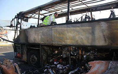 An Israeli emergency rescue team examines the remains of a bus bombed by Hezbollah in Bulgaria in July, 2012. (Dano Monkotovic/Flash90/JTA)